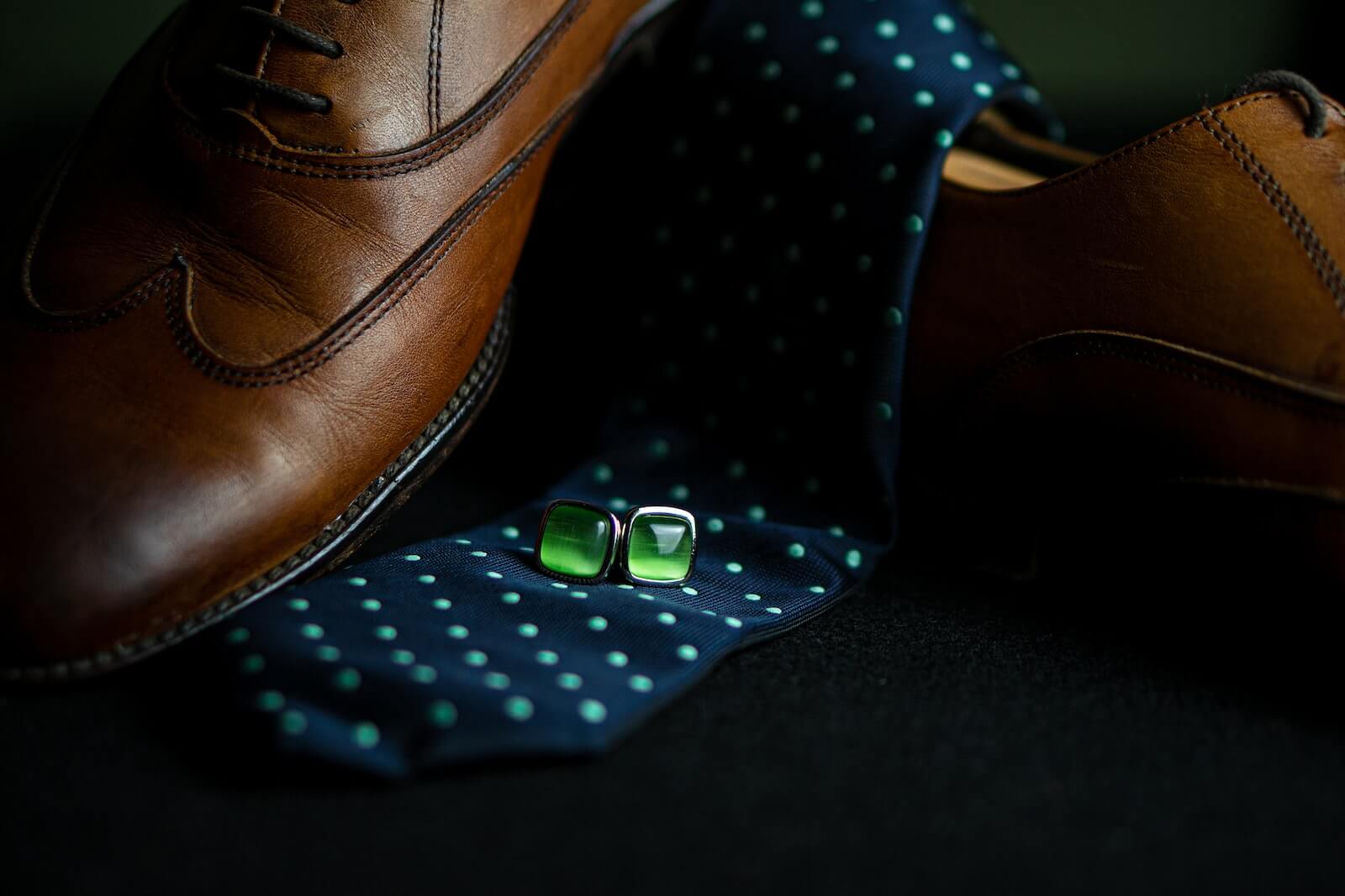 brown leather shoe with blue and white polka dot