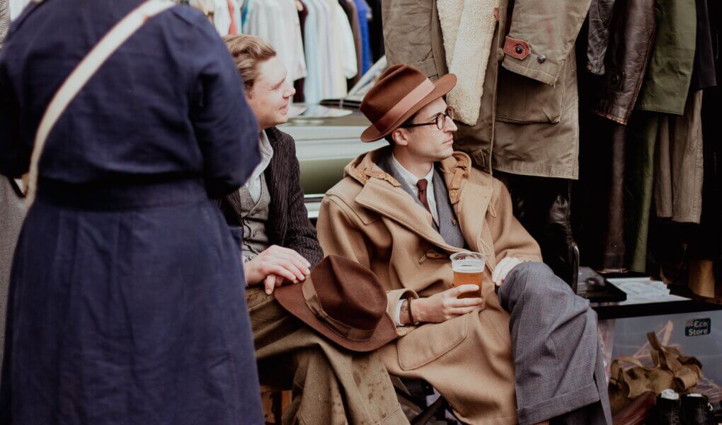 a man sitting on a bench next to a woman