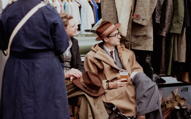 a man sitting on a bench next to a woman