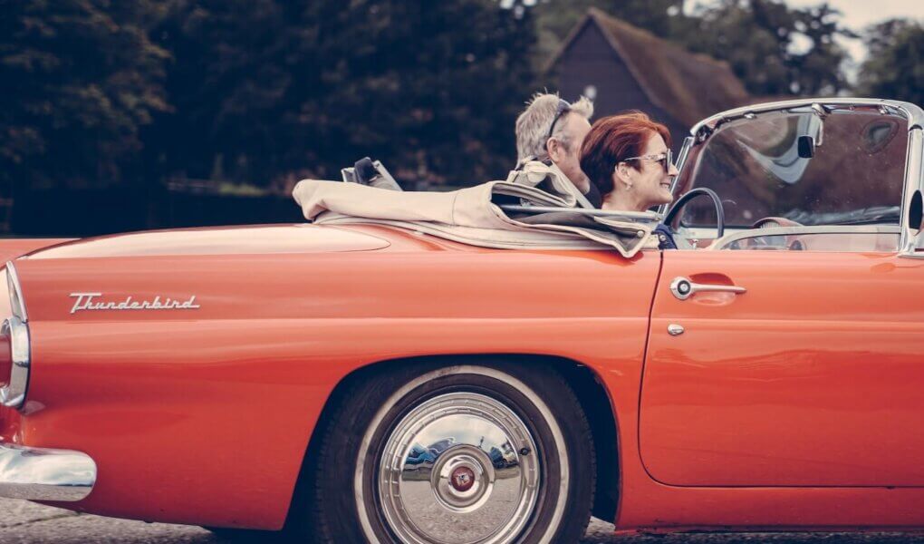 two person riding vintage coupe