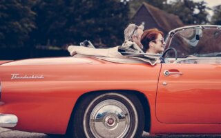 two person riding vintage coupe