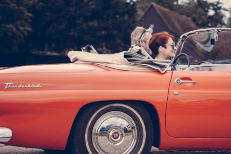 two person riding vintage coupe