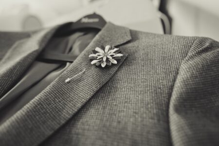 closeup photo of gray notched lapel suit jacket