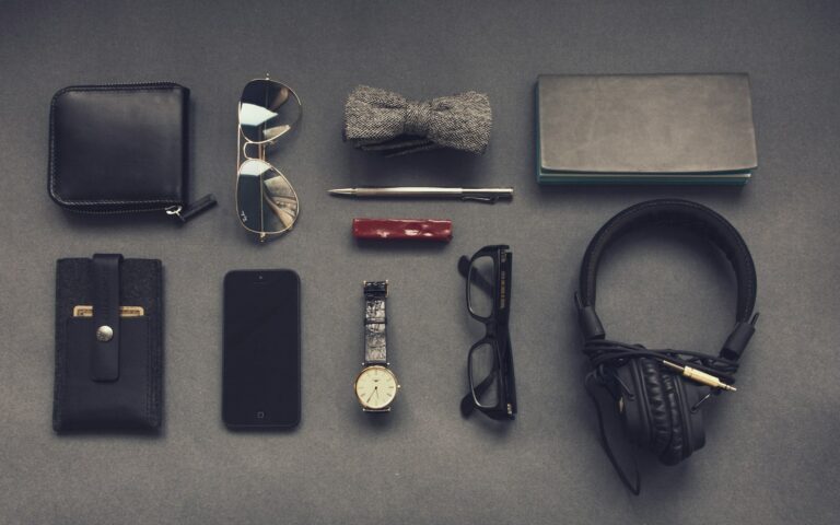 black corded headphones near eyeglasses