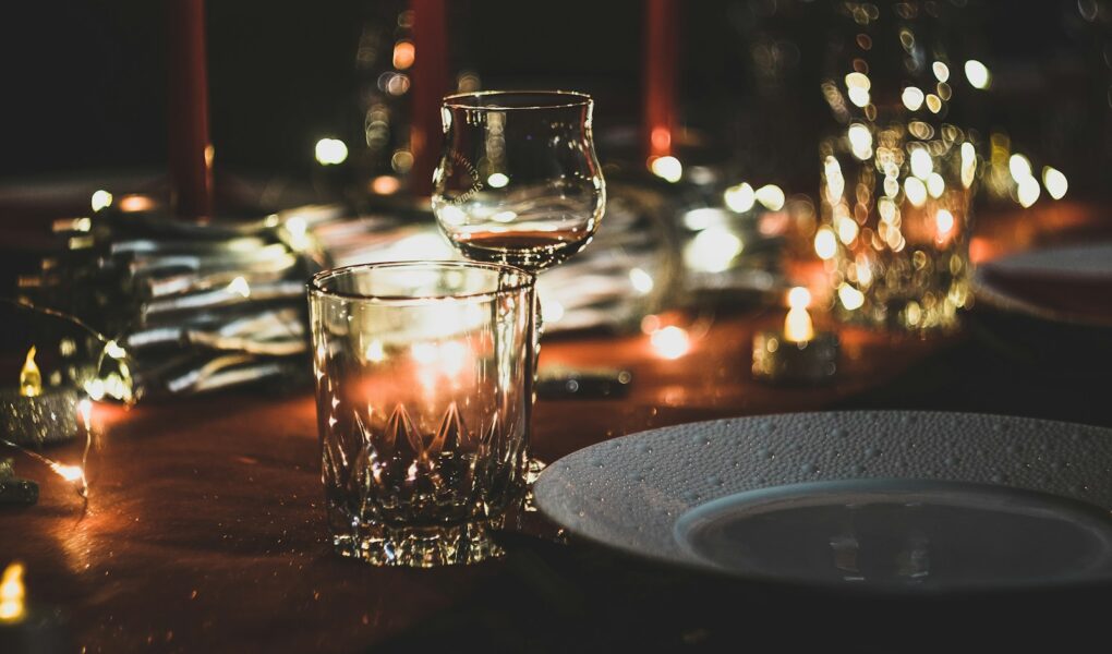 selective focus photography of wine glass and shot glass on table