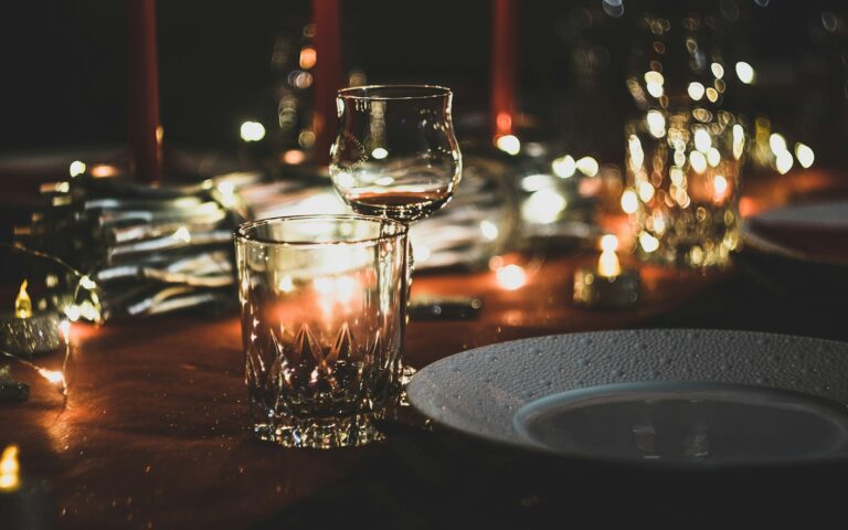 selective focus photography of wine glass and shot glass on table