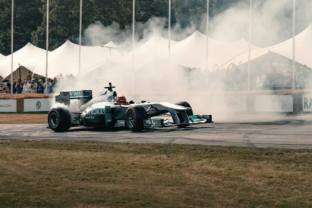 A man driving a race car on top of a race track