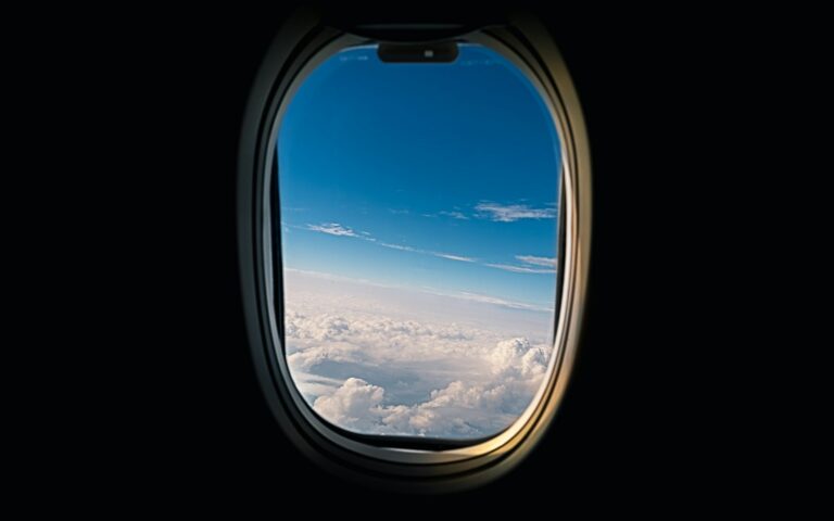 airline window viewing white clouds